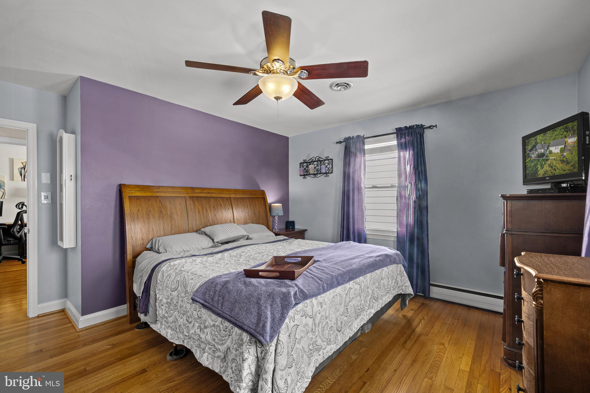 6226 2nd Avenue Hanover, MD 21076 - Photo 16 of 48 a bedroom with a bed and wooden floor
