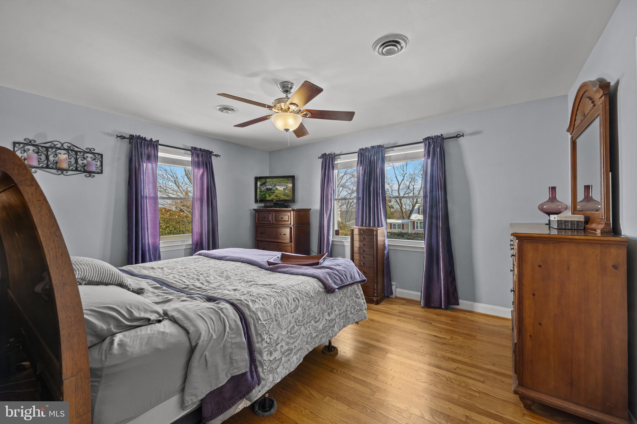 6226 2nd Avenue Hanover, MD 21076 - Photo 17 of 48 a bedroom with a bed dresser and a large mirror