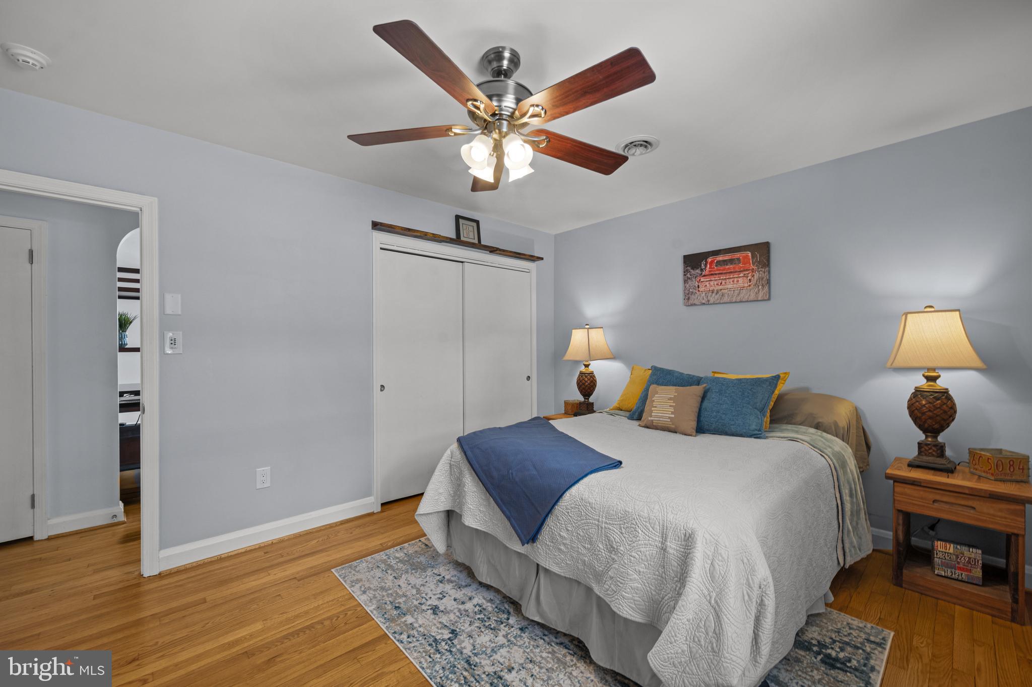 6226 2nd Avenue Hanover, MD 21076 - Photo 19 of 48 a bed room with a bed and a chandelier