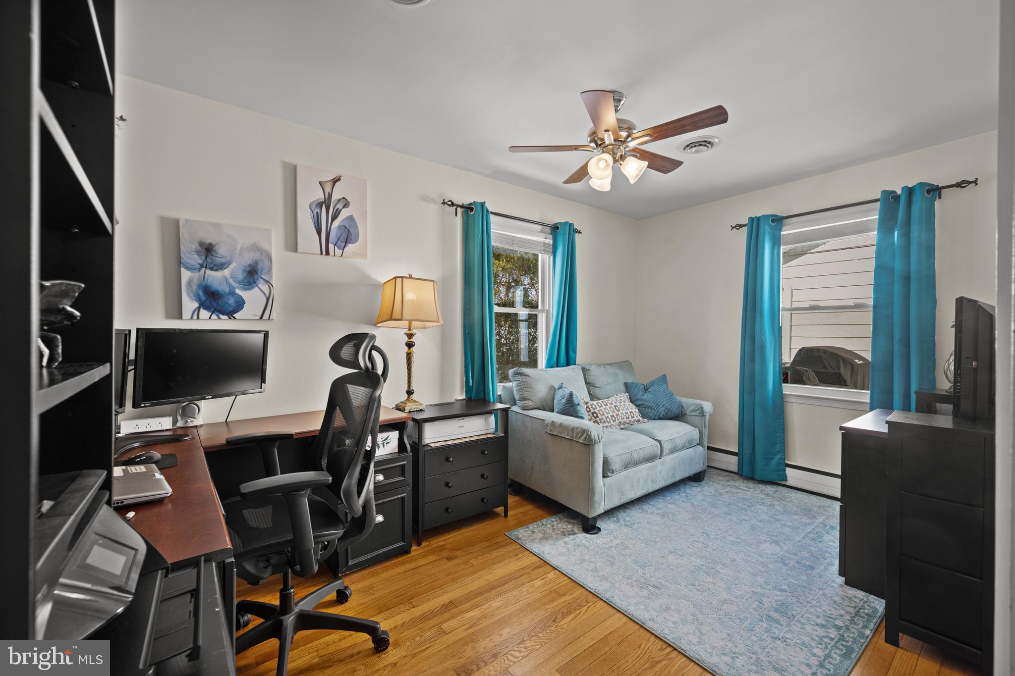 6226 2nd Avenue Hanover, MD 21076 - Photo 20 of 48 a living room with furniture and a flat screen tv