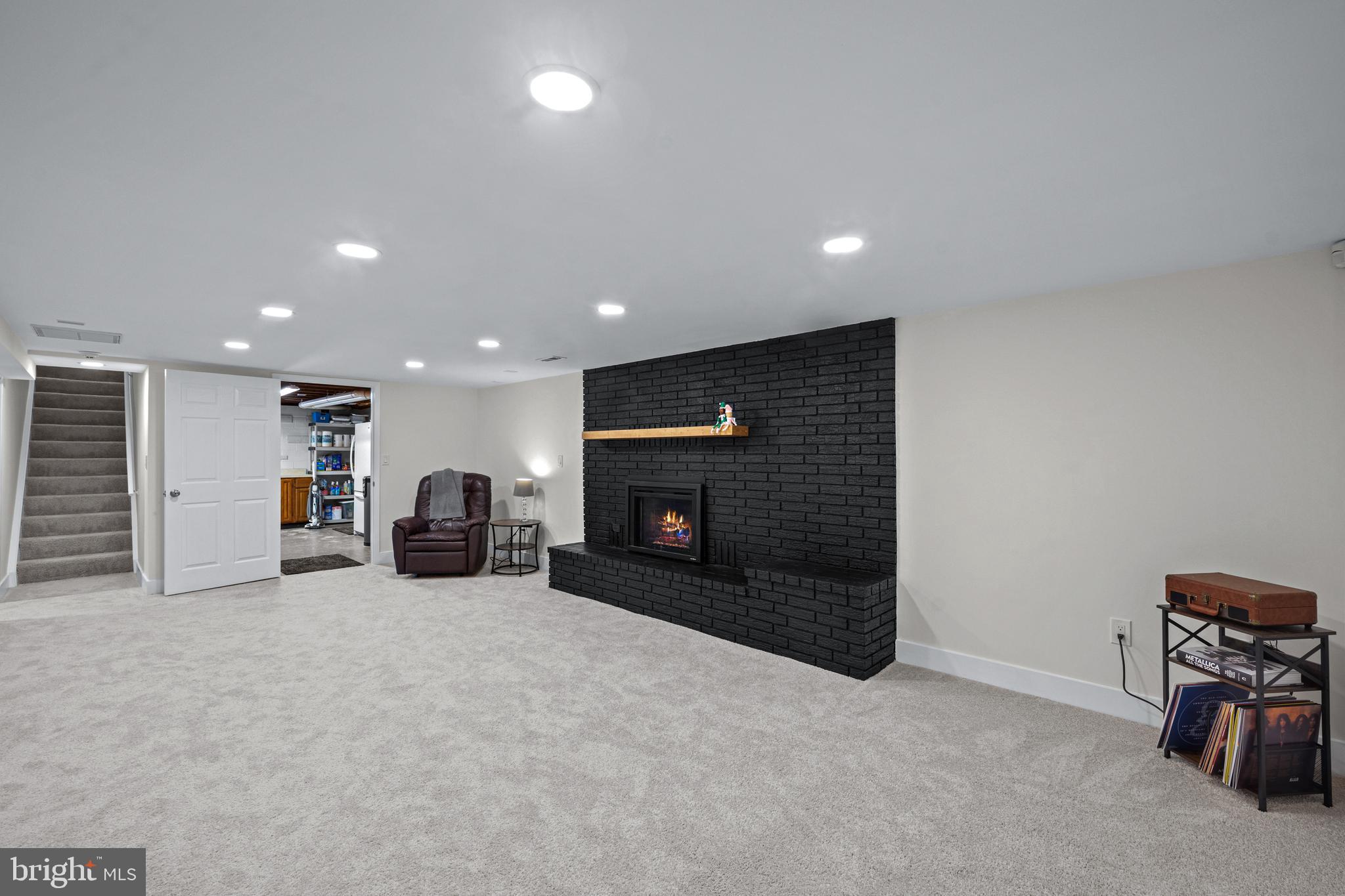 6226 2nd Avenue Hanover, MD 21076 - Photo 23 of 48 an empty room with furniture and a fireplace