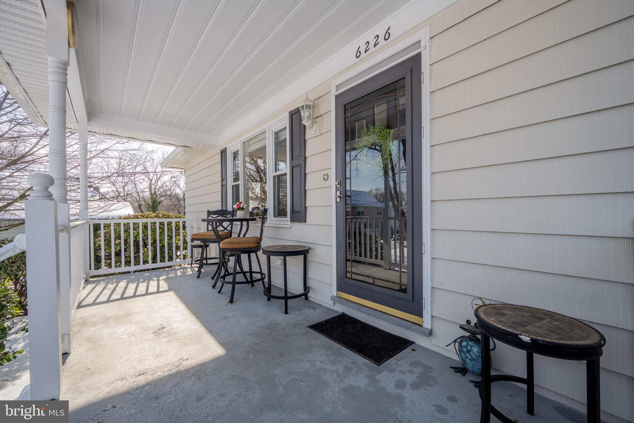 6226 2nd Avenue Hanover, MD 21076 - Photo 3 of 48 a view of a porch with furniture and floor to ceiling window