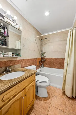 a bathroom with a sink a toilet and a bathtub