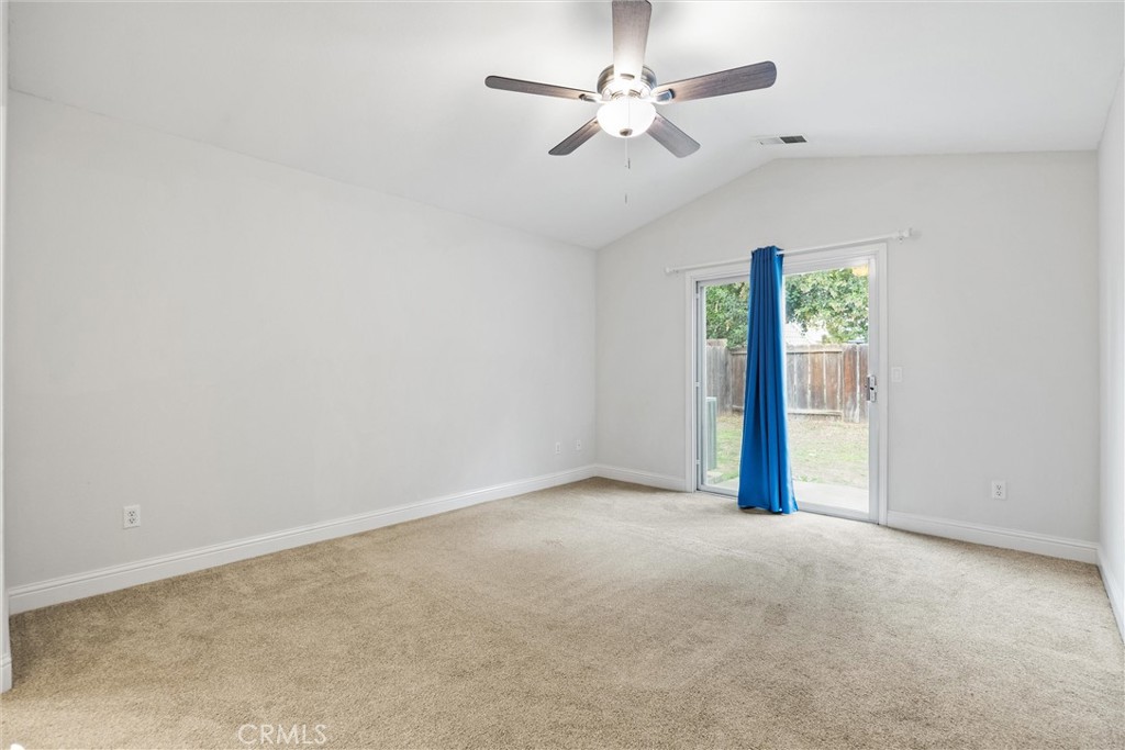 1165 Fig Street Corning, CA 96021 - Photo 17 of 46 an empty room with windows and fan