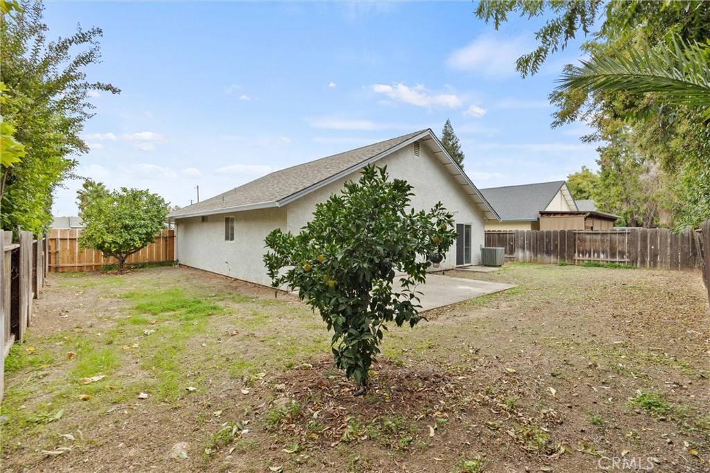 1165 Fig Street Corning, CA 96021 - Photo 28 of 46 a view of a house with backyard and a tree
