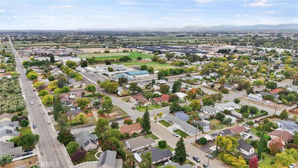 1165 Fig Street Corning, CA 96021 - Photo 38 of 46 an aerial view of a city with lots of residential buildings