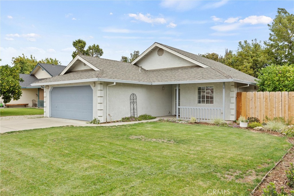 1165 Fig Street Corning, CA 96021 - Photo 45 of 46 a front view of a house with a yard and garage