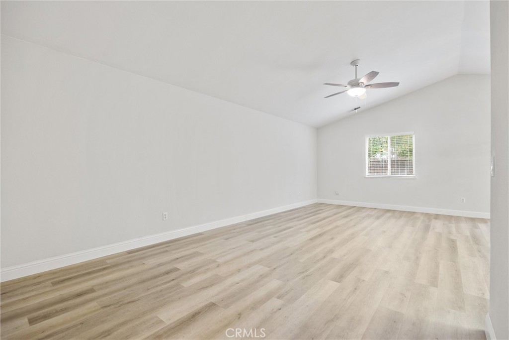 1165 Fig Street Corning, CA 96021 - Photo 6 of 46 wooden floor in an empty room with a window