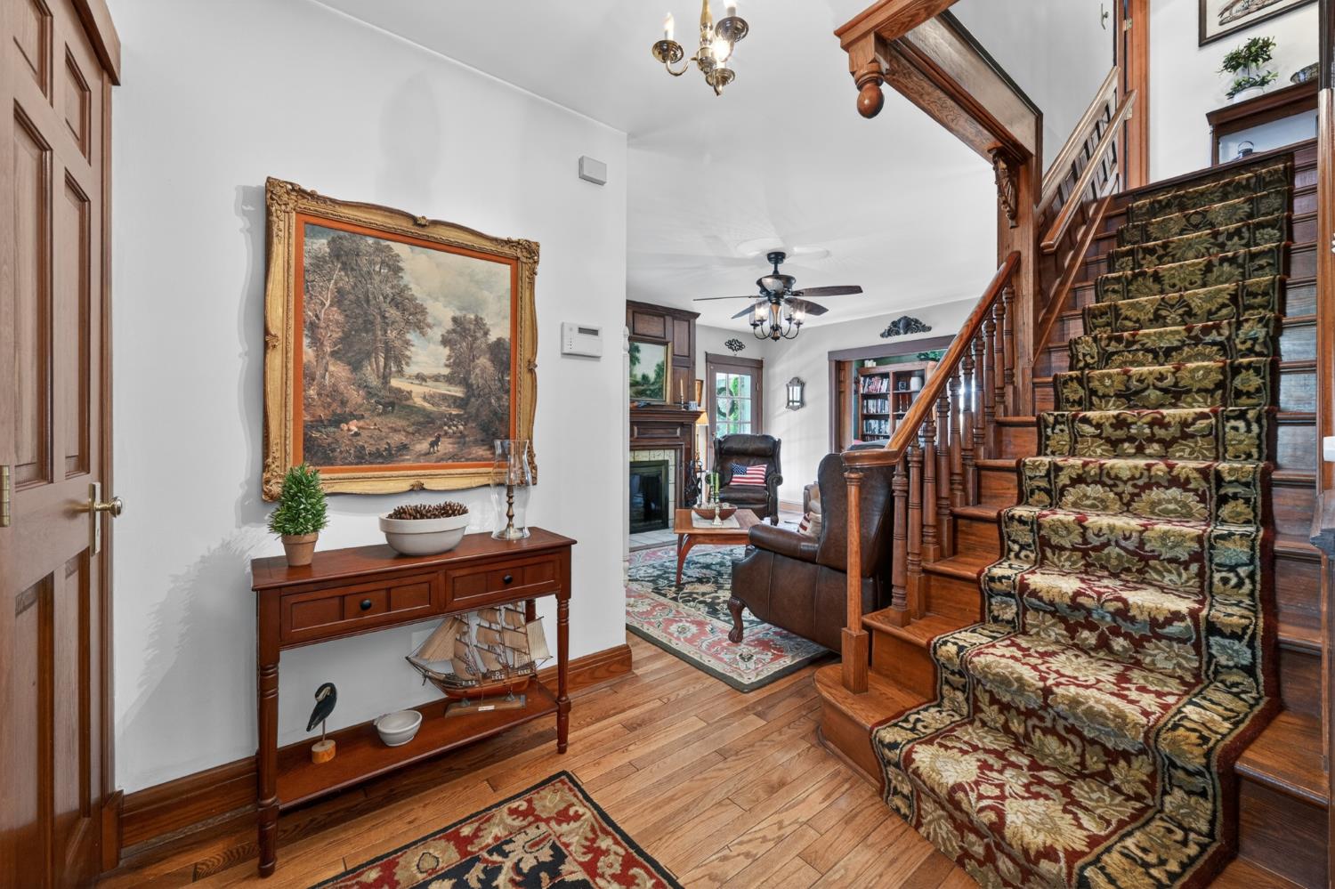 2179 Webb Road Brookville, IN 47012 - Photo 9 of 84 Inside the front door, quality and care is evident everywhere you look! An open wood staircase accented by solid oak wainscoting leads to the second level... beautiful oak floors flow throughout, and a closet is convenient!