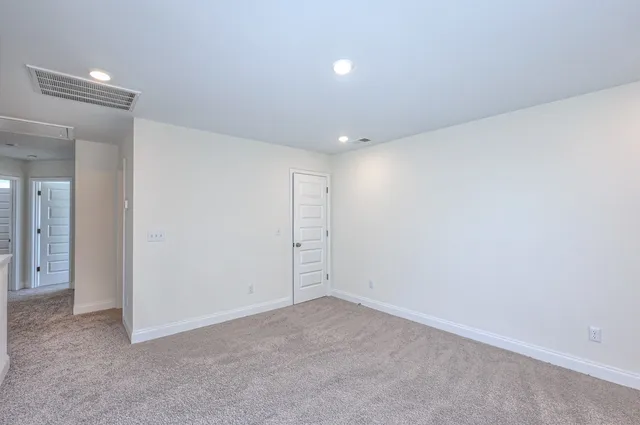 a white toilet sitting next to a bath tub