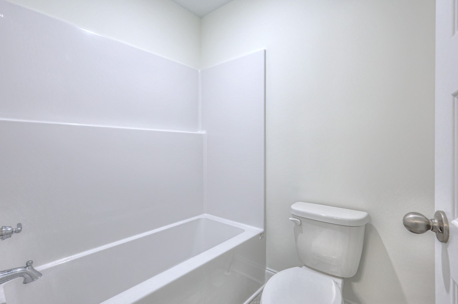 1033 Bluestem Road Columbia, TN 38401 - Photo 25 of 36 a white toilet sitting next to a bath tub