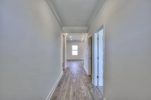 a view of gallery with wooden floor