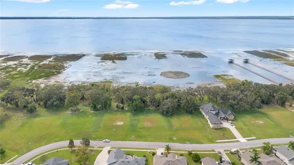 a view of a lake with a yard