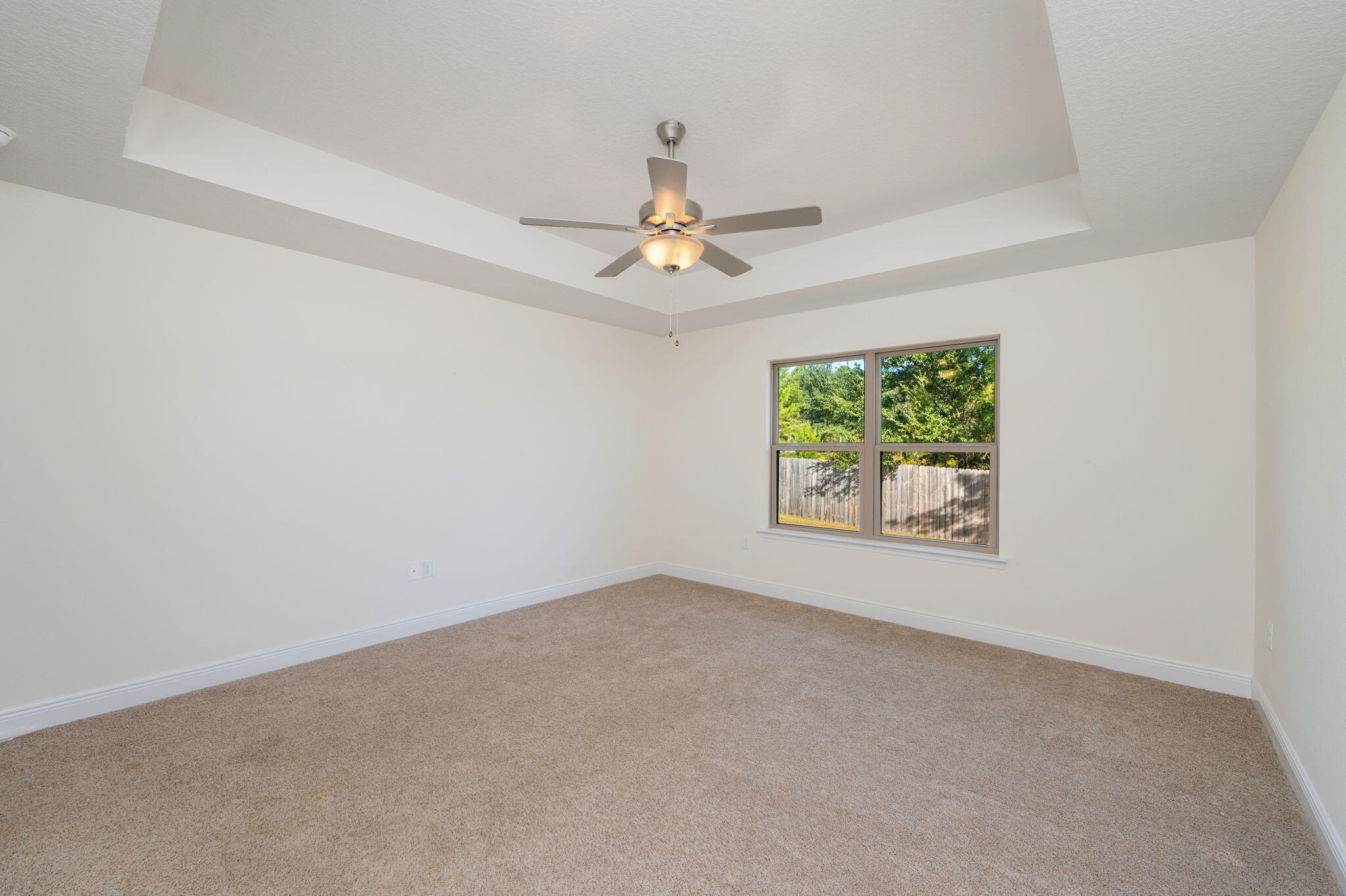 10152 American Farms Road Milton, FL 32583 - Photo 21 of 49 an empty room with windows and ceiling fan