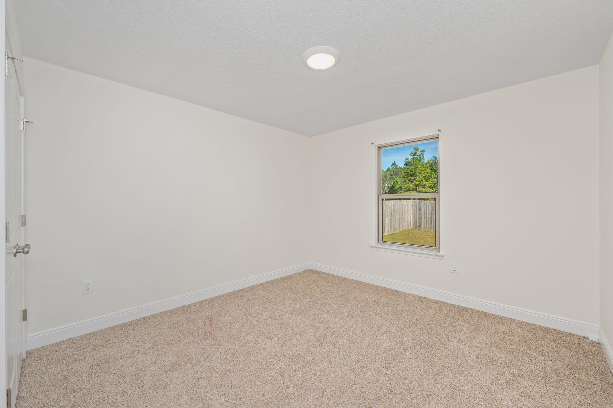 10152 American Farms Road Milton, FL 32583 - Photo 29 of 49 an empty room with a window
