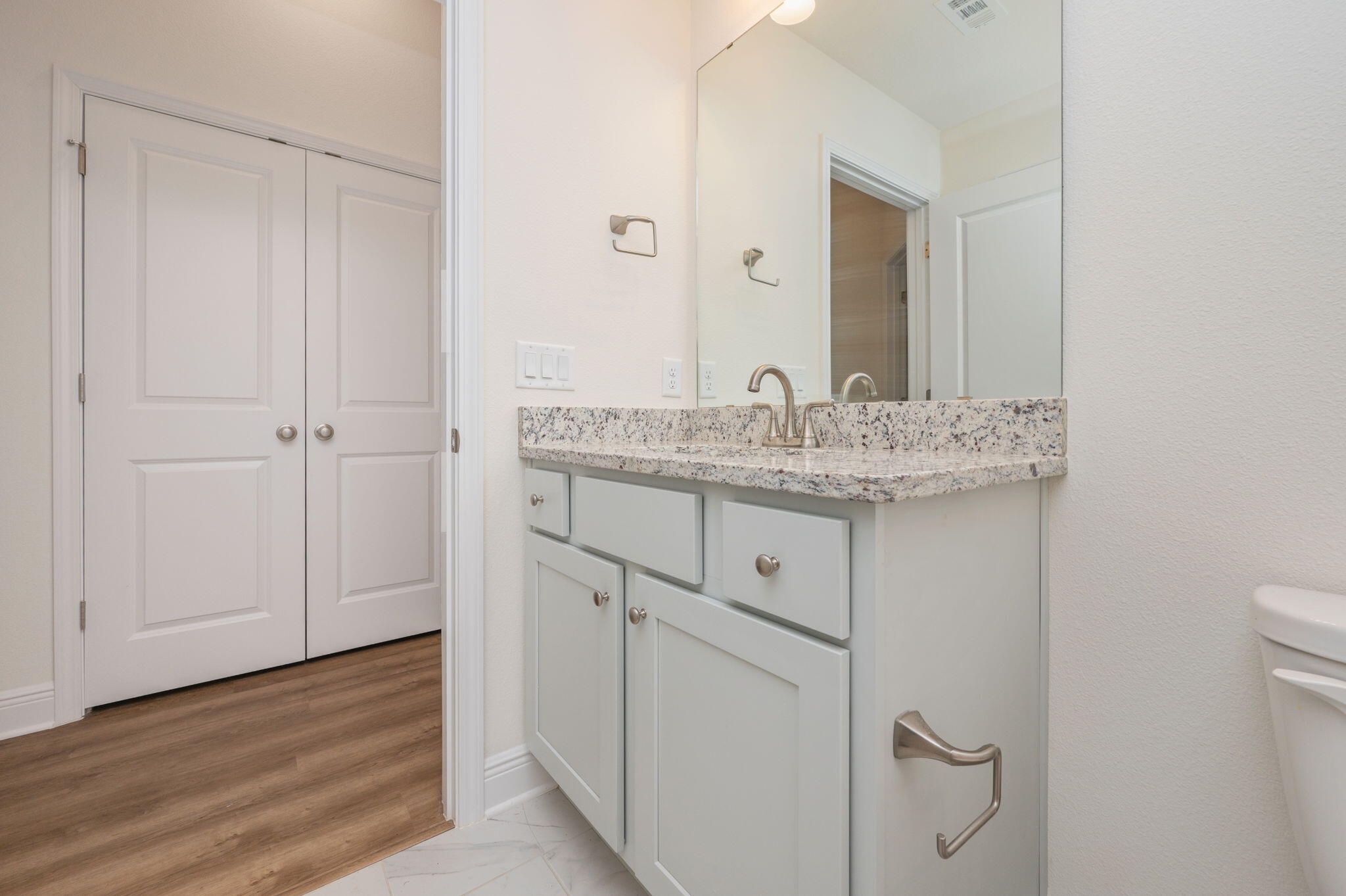 10152 American Farms Road Milton, FL 32583 - Photo 33 of 49 a bathroom with a granite countertop sink and a mirror