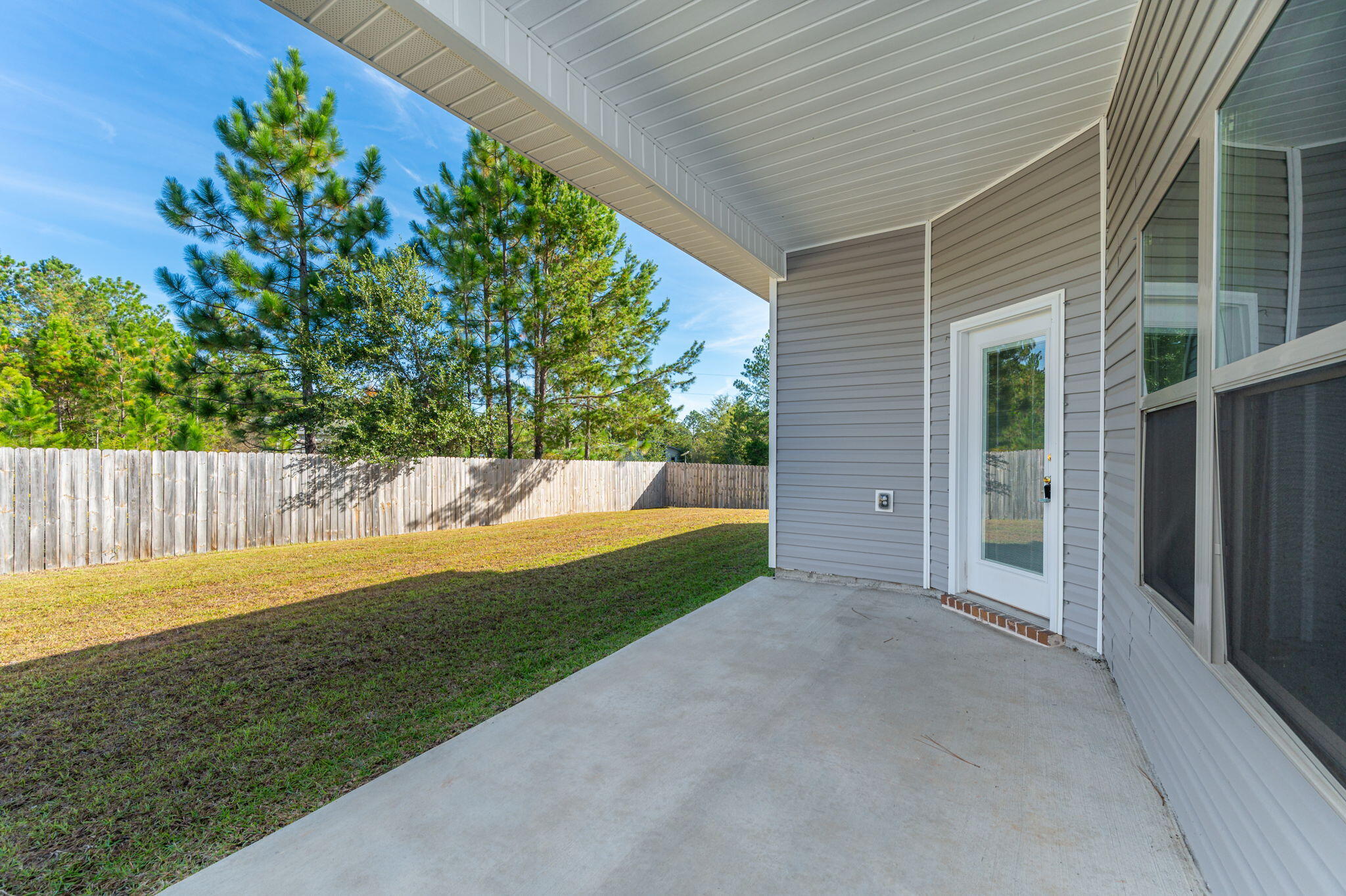10152 American Farms Road Milton, FL 32583 - Photo 36 of 49 a view of a backyard with large trees