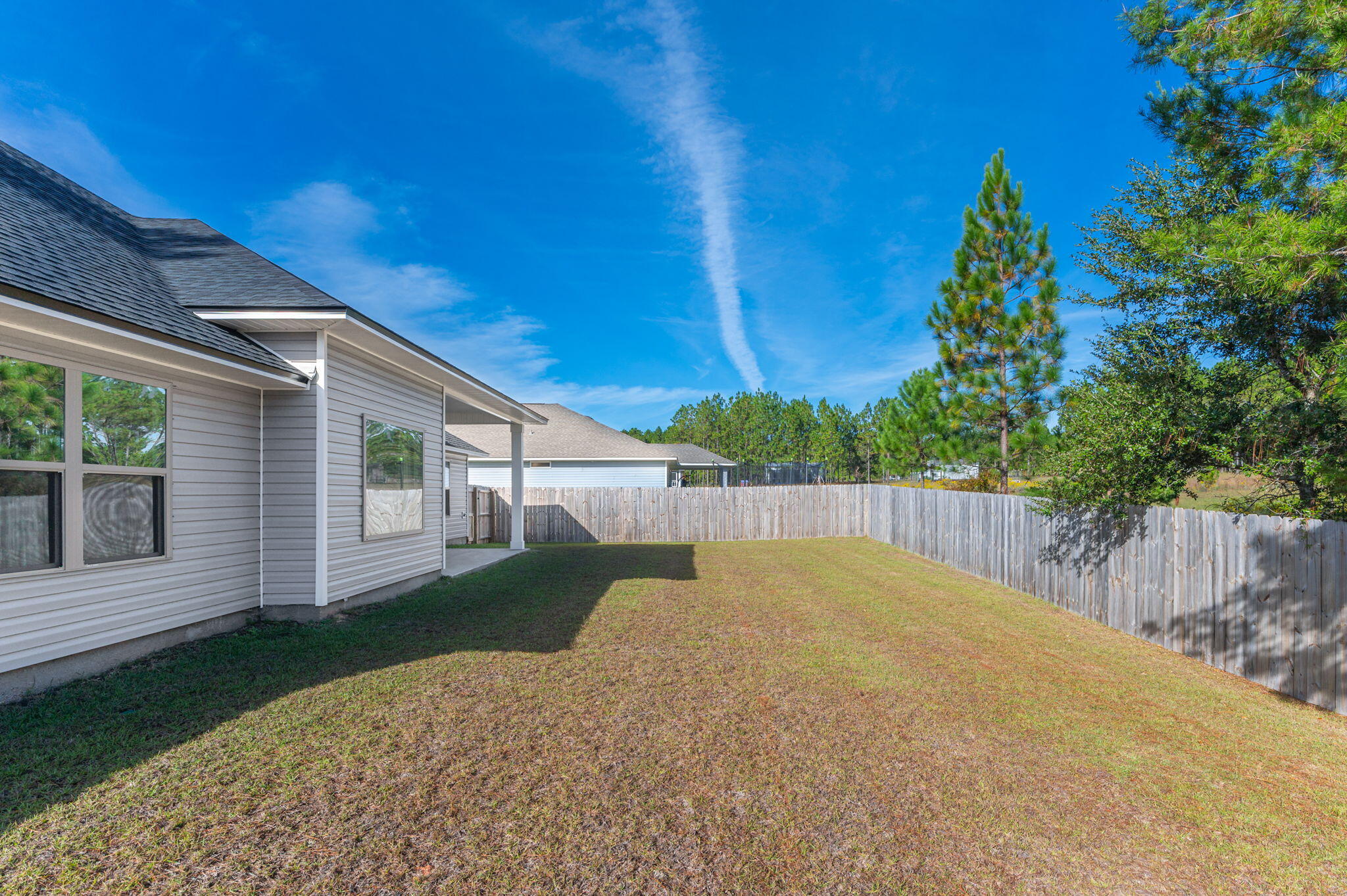10152 American Farms Road Milton, FL 32583 - Photo 43 of 49 front view of a house with a yard