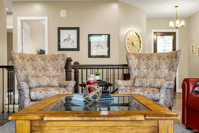 a view of kitchen with dining area and chandelier