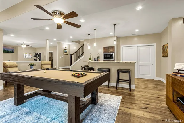 a large kitchen with a table and chairs