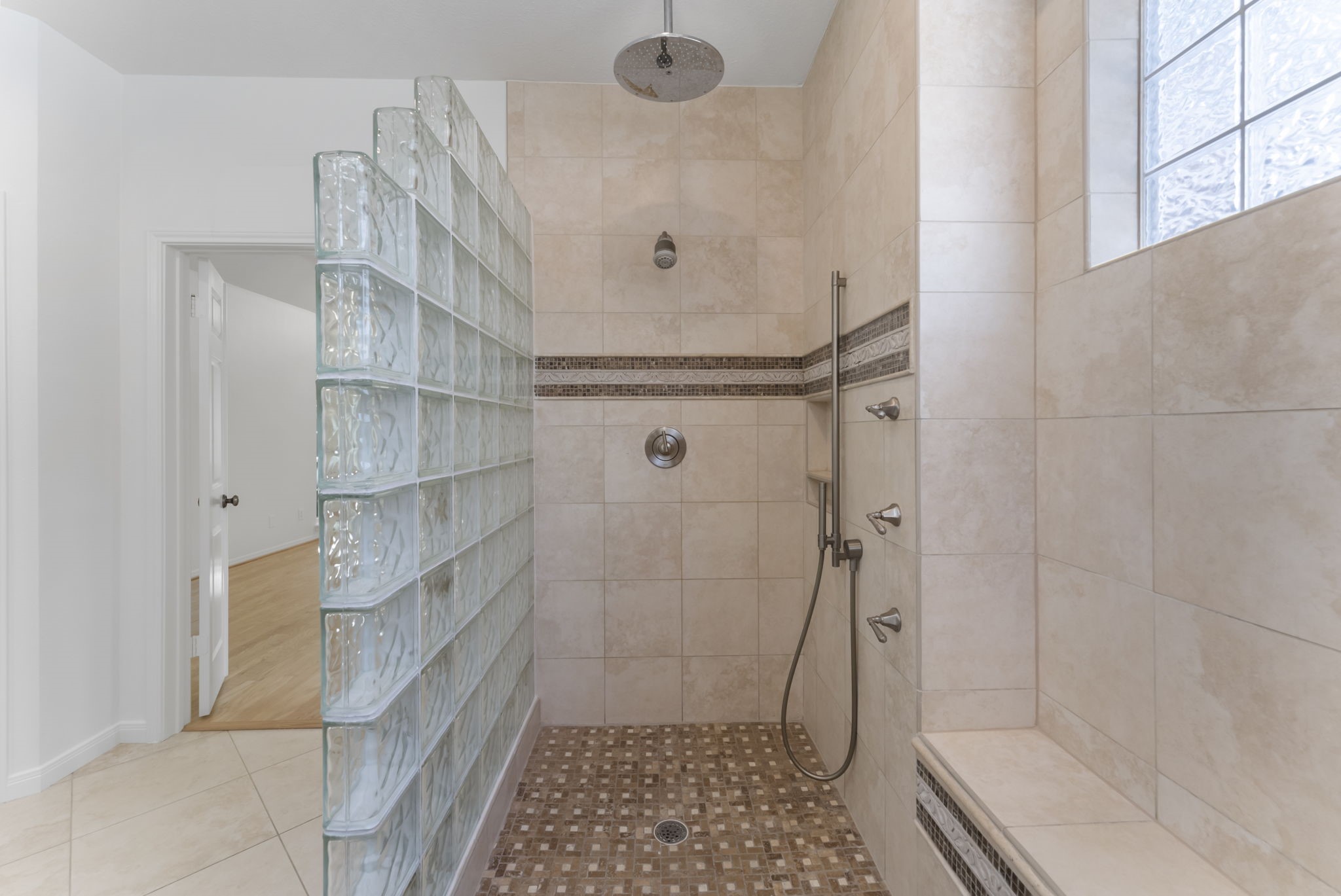 38 North Dragonwood Place Spring, TX 77381 - Photo 18 of 50 Oversized walk-in shower with multiple showerheads for a spa-level upgrade.