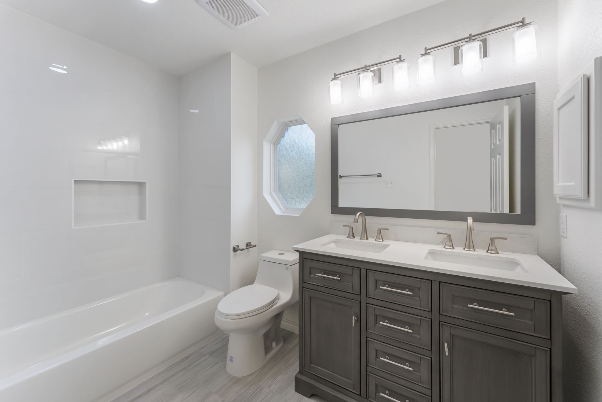 38 North Dragonwood Place Spring, TX 77381 - Photo 30 of 50 Two secondary bedrooms upstairs share this newly remodeled bathroom.