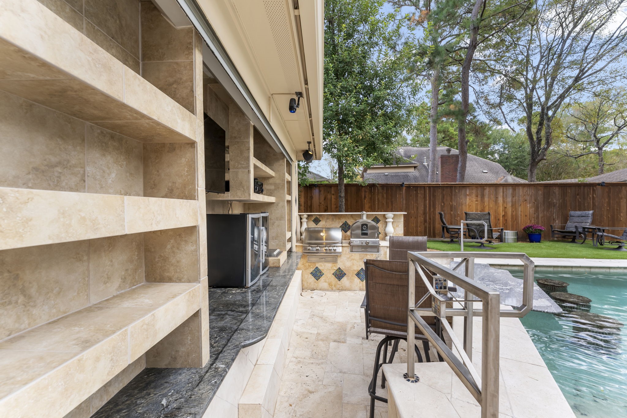 38 North Dragonwood Place Spring, TX 77381 - Photo 36 of 50 Swim up bar and summer kitchen with a pizza oven!