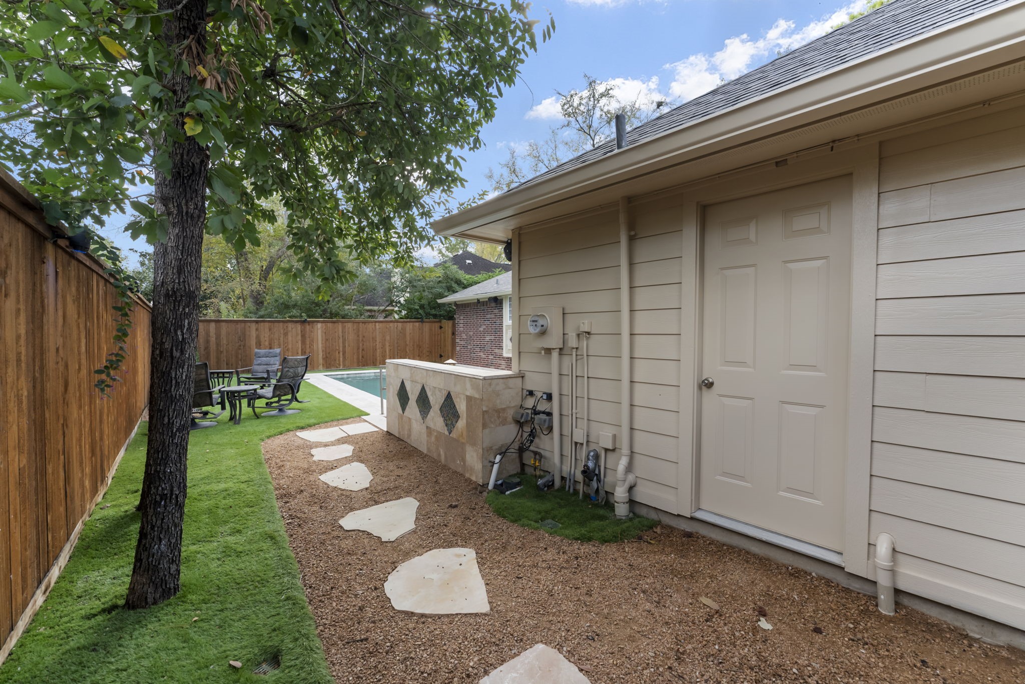 38 North Dragonwood Place Spring, TX 77381 - Photo 43 of 50 The pool bath is conveniently located just behind the garage.
