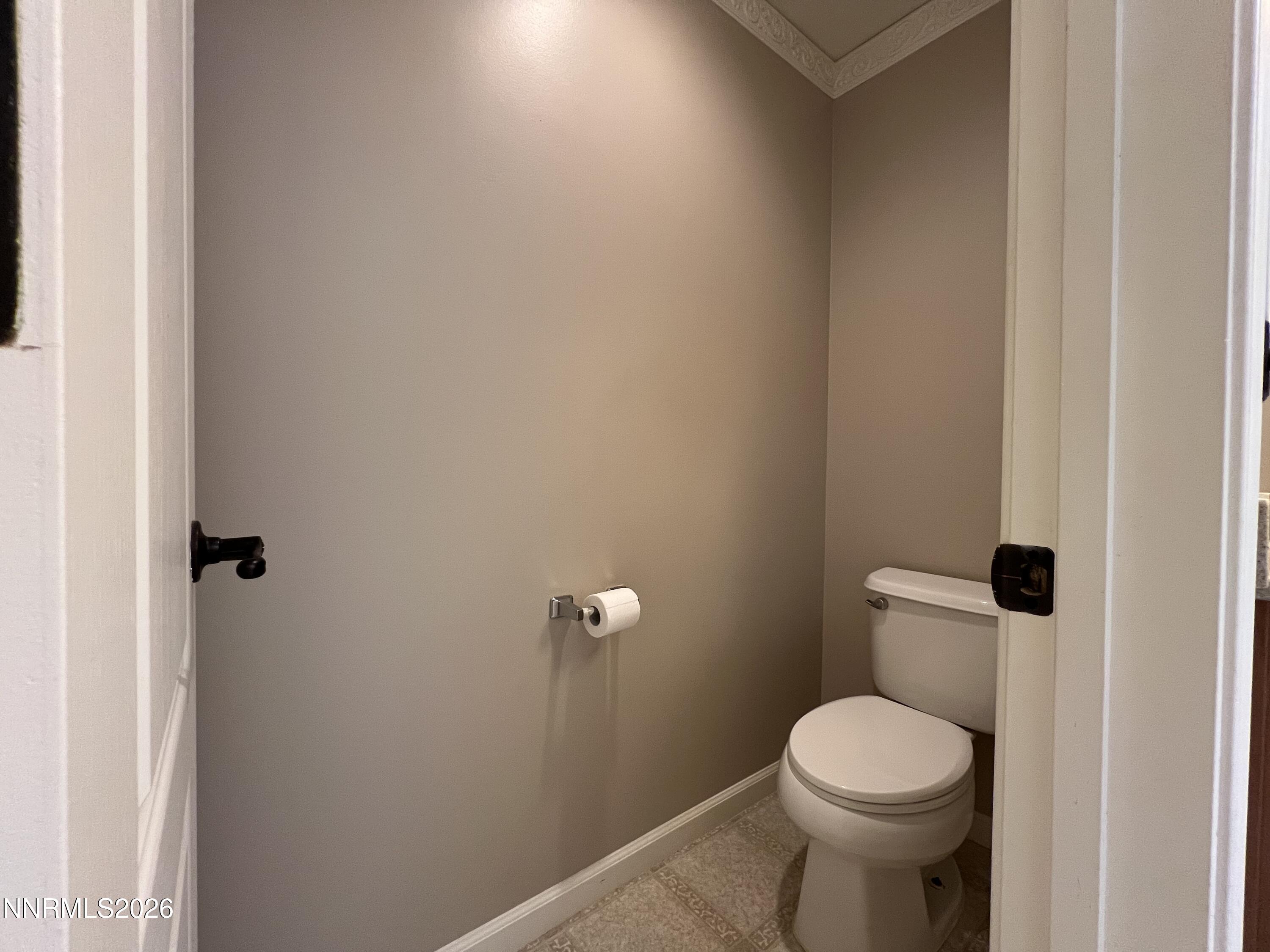 18406 Teddy Bear Court Reno, NV 89508 - Photo 21 of 44 a white toilet sitting next to a bathroom sink