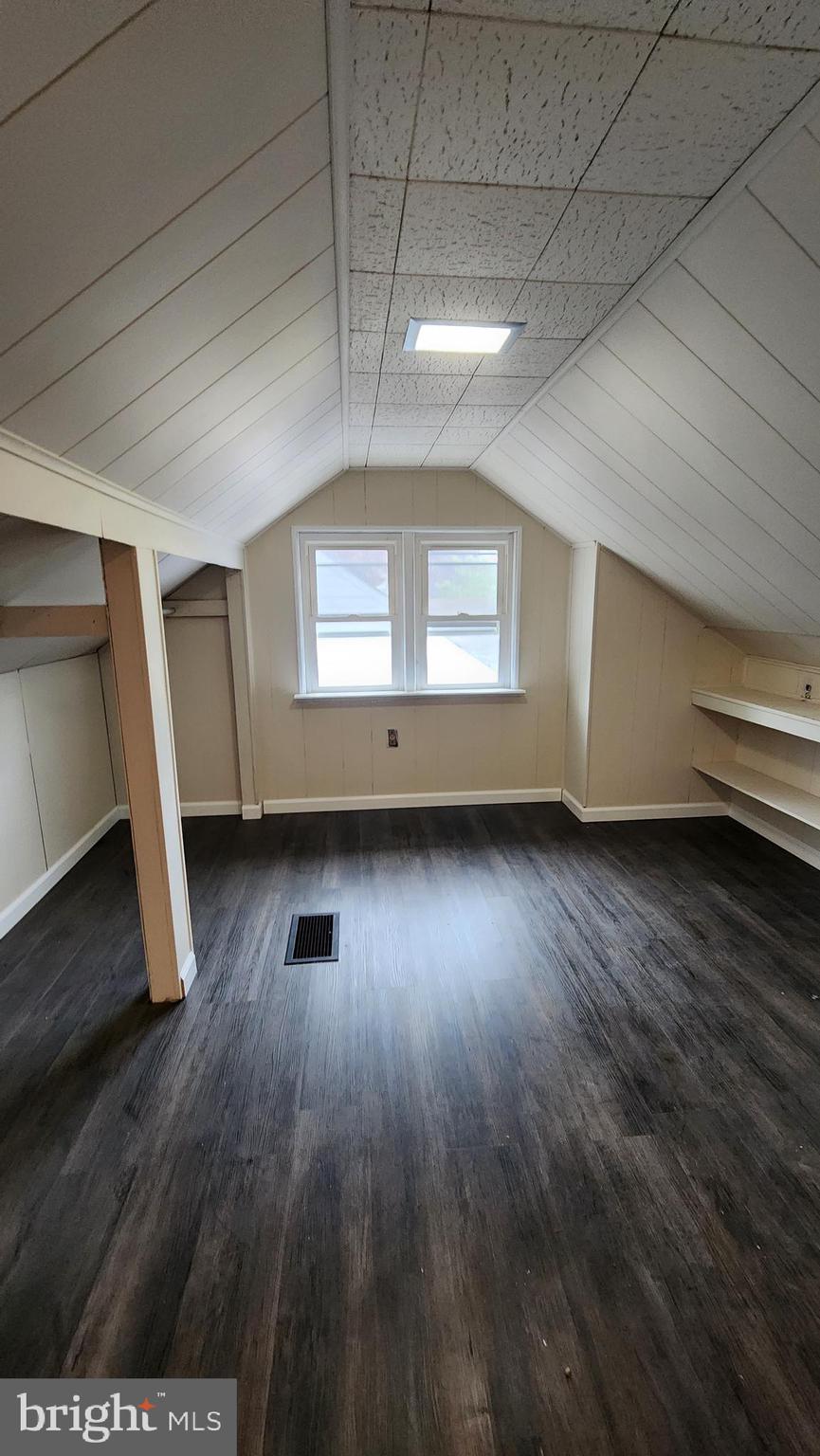 407 West High Street Glassboro, NJ 08028 - Photo 11 of 14 an empty room with wooden floor and windows