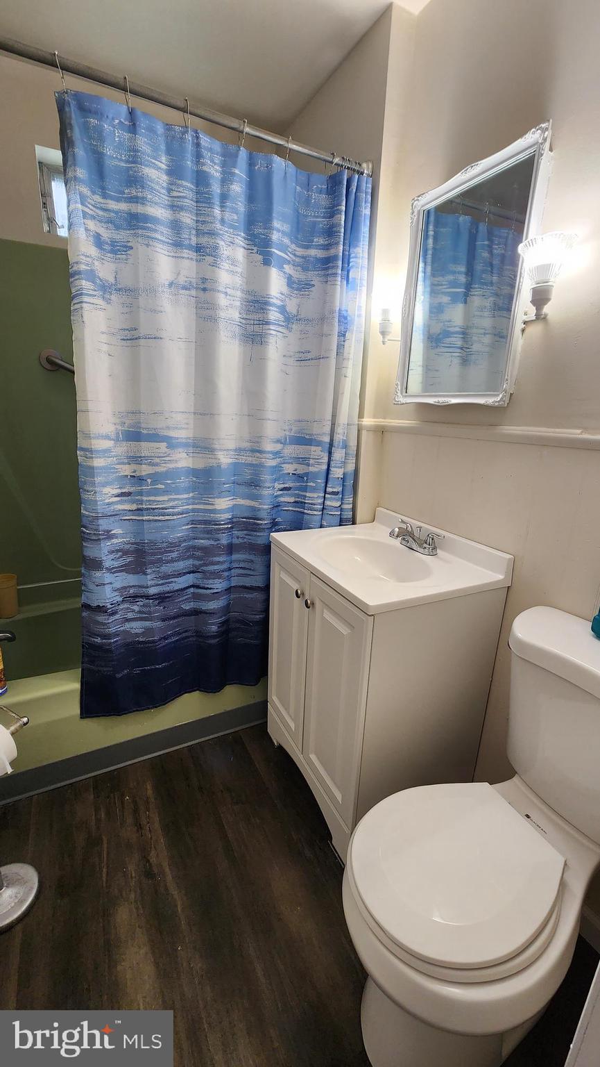 407 West High Street Glassboro, NJ 08028 - Photo 12 of 14 a bathroom with a toilet and a sink