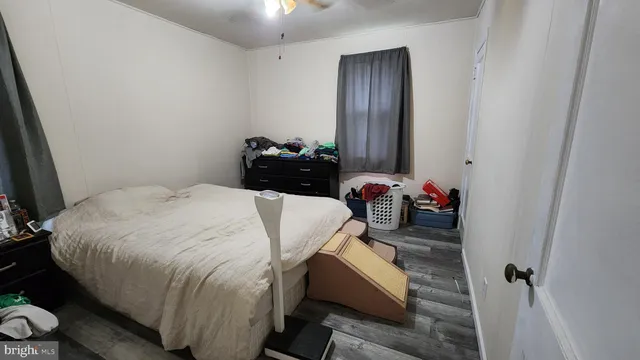 a bedroom with a bed and a mirror