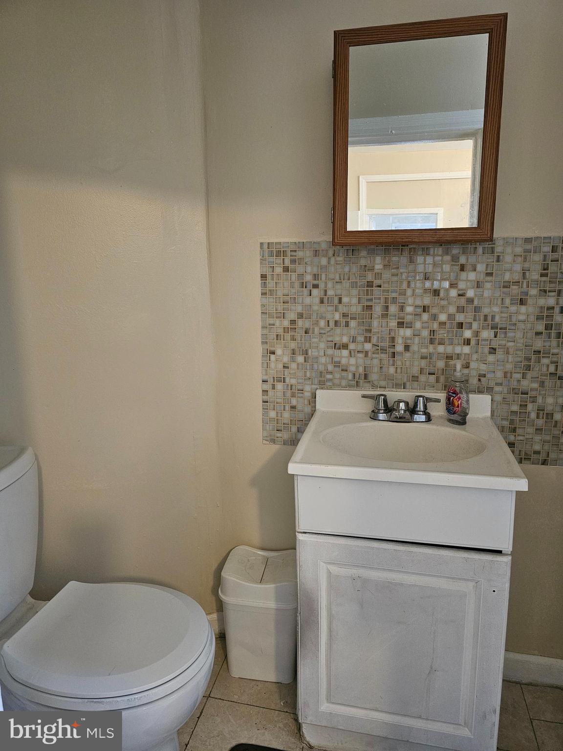 1322 Windrim Avenue Philadelphia, PA 19141 - Photo 8 of 14 a bathroom with a toilet sink and mirror