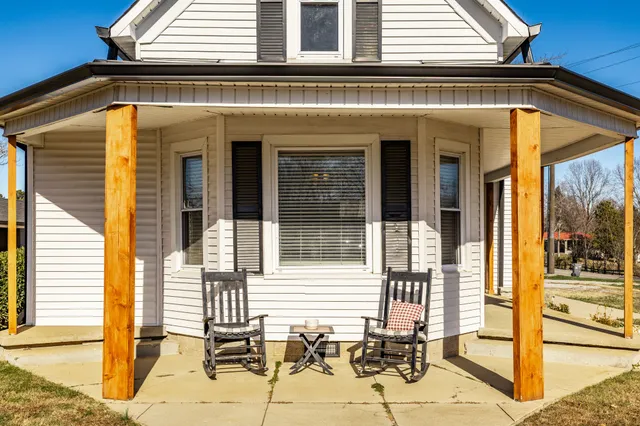 a front view of a house with large windows
