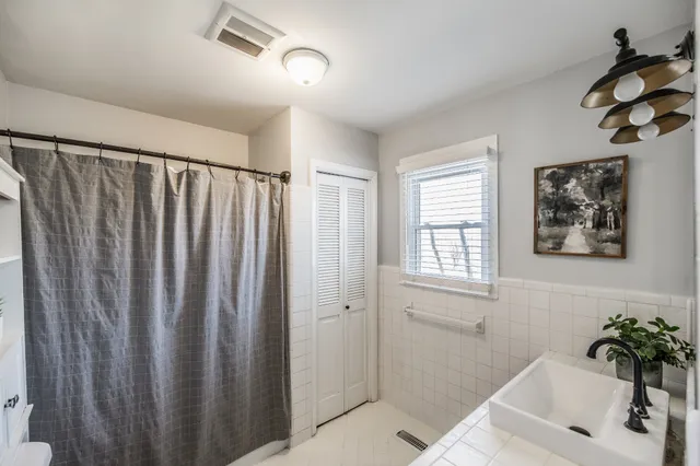 a bathroom with a bathtub and shower