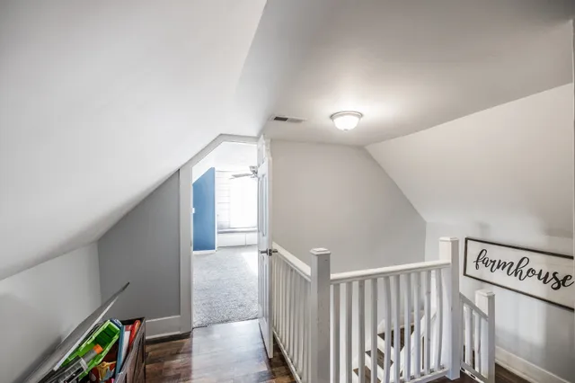 a view of entryway with stairs and wooden floor