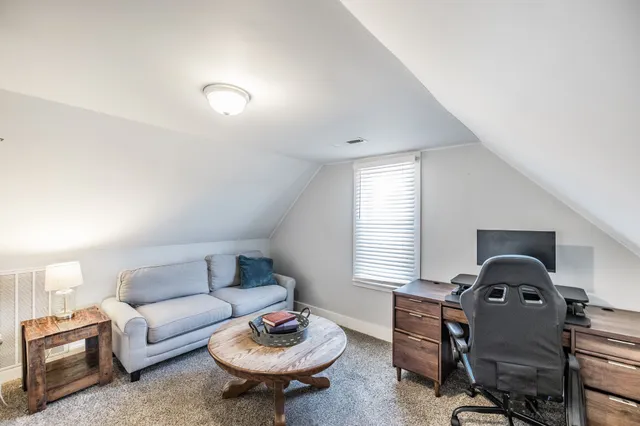 a living room with furniture and a table
