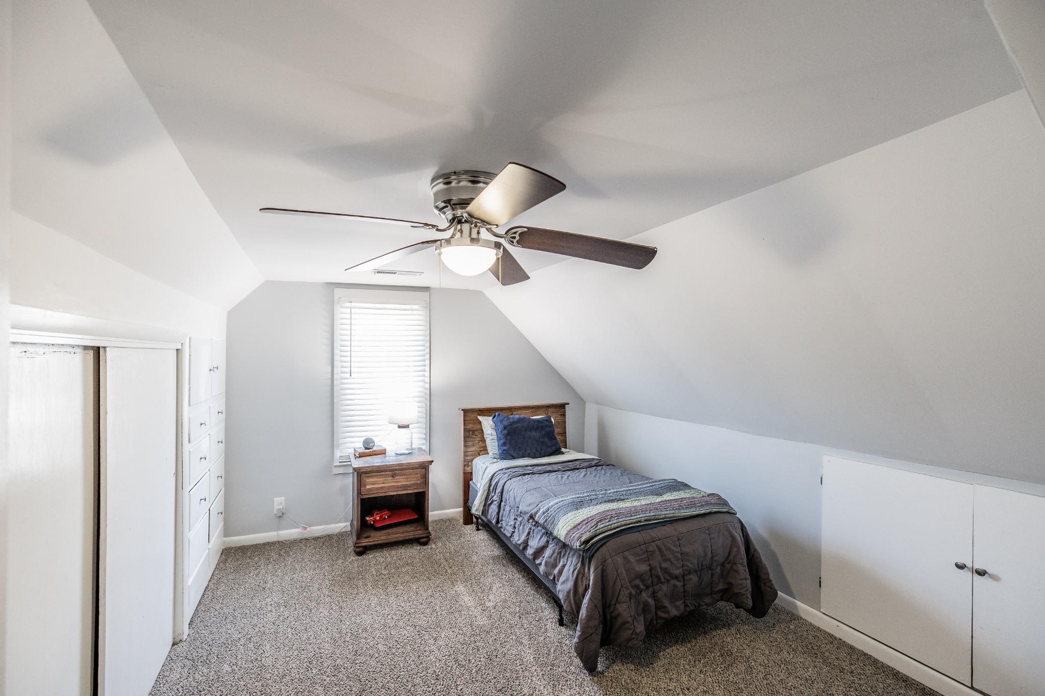 2999 Oak Grove Church Road Bethpage, TN 37022 - Photo 31 of 44 a bedroom with a bed and a chandelier