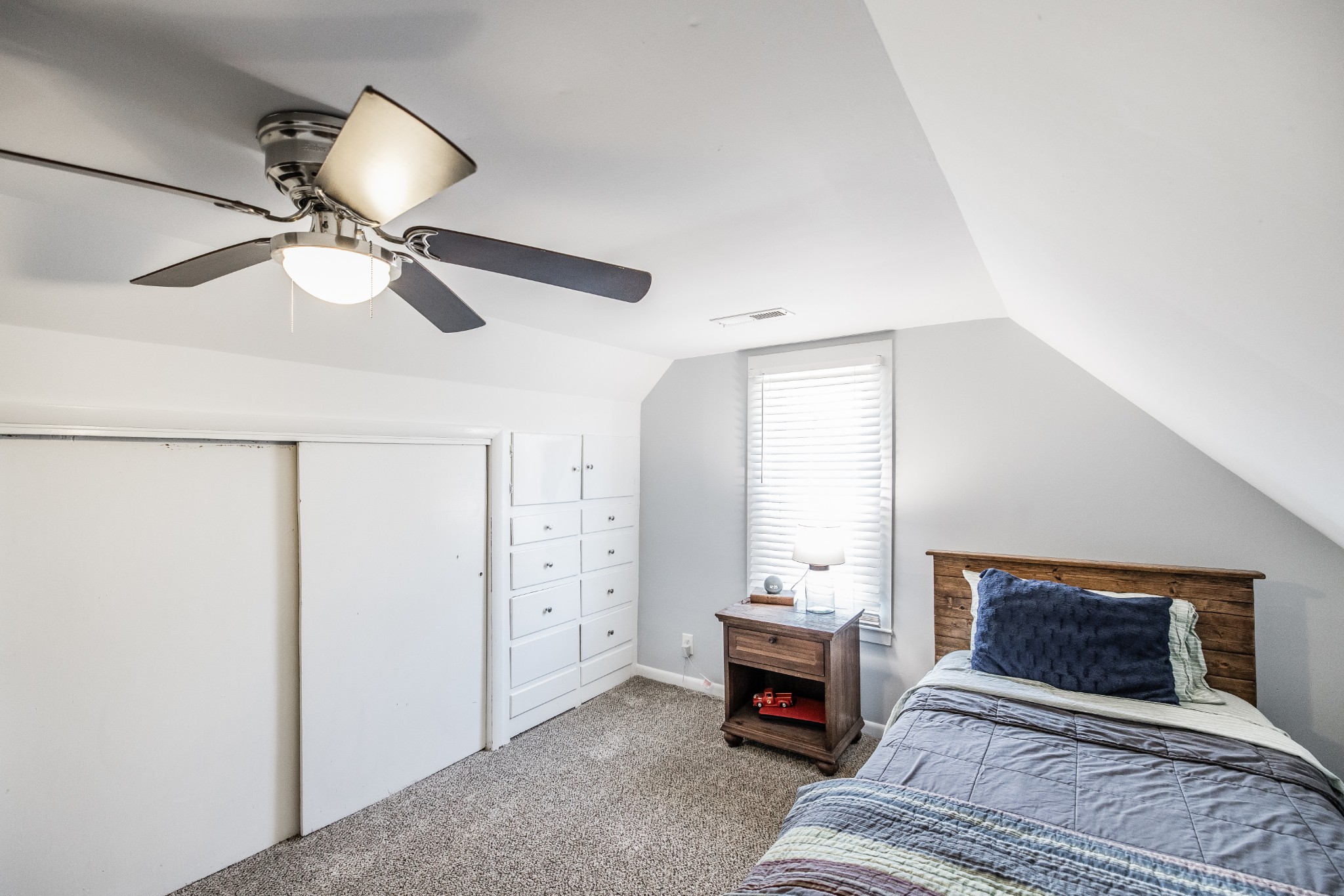 2999 Oak Grove Church Road Bethpage, TN 37022 - Photo 33 of 44 a bedroom with a bed and a chandelier