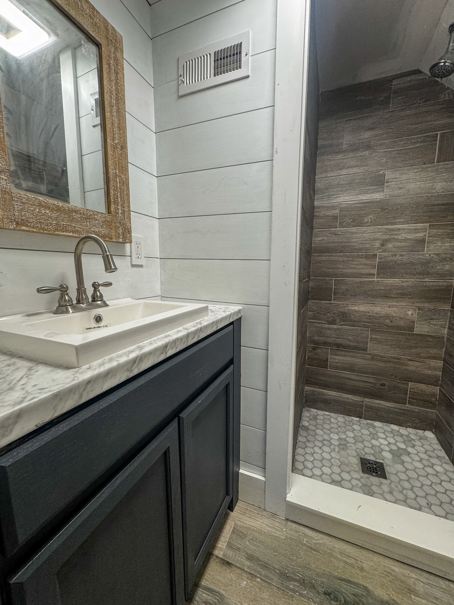 2999 Oak Grove Church Road Bethpage, TN 37022 - Photo 35 of 44 a bathroom with a sink shower and a mirror