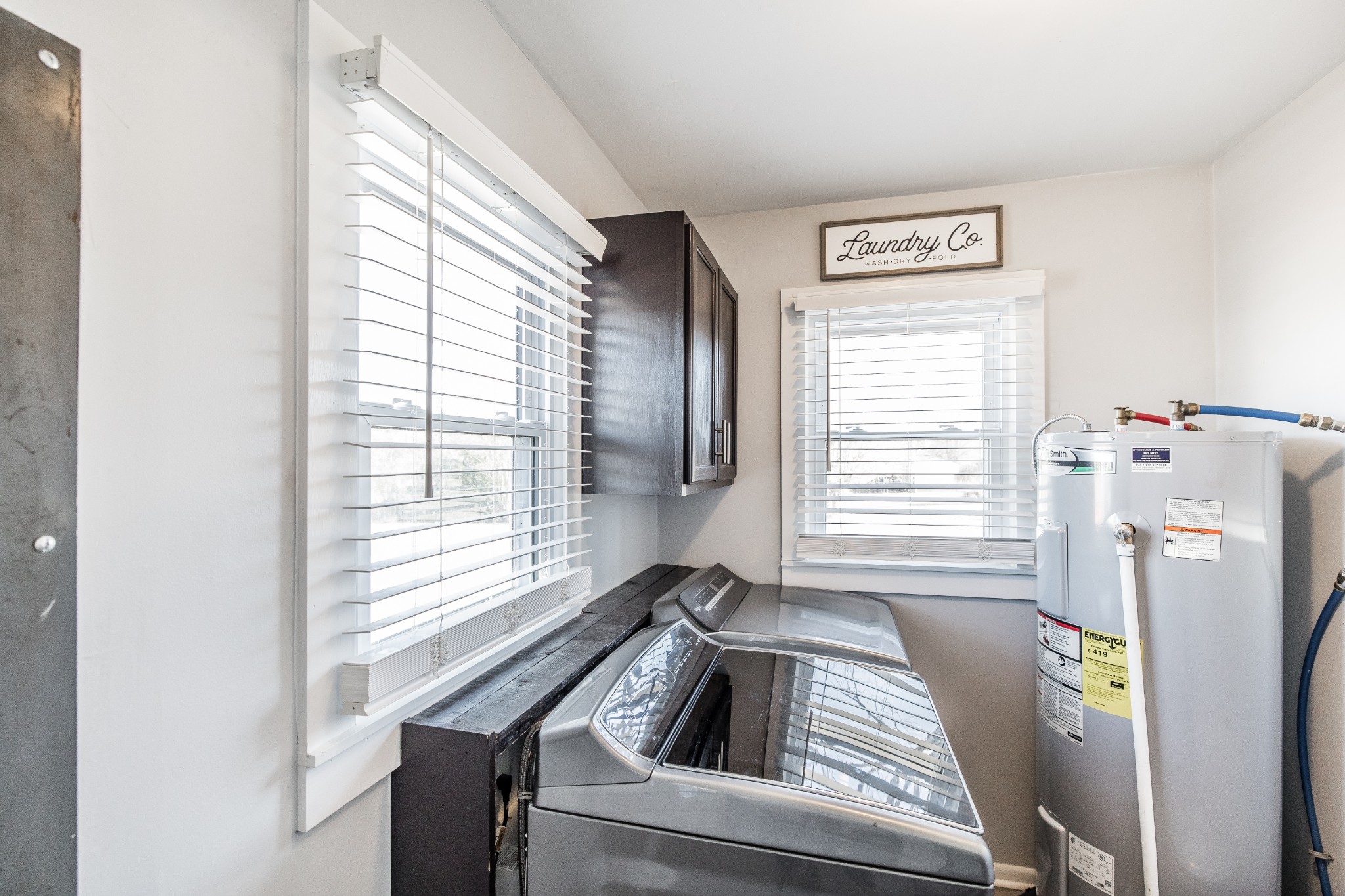 2999 Oak Grove Church Road Bethpage, TN 37022 - Photo 39 of 44 a kitchen with a window a refrigerator and washer