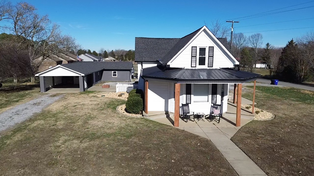 2999 Oak Grove Church Road Bethpage, TN 37022 - Photo 6 of 44 a view of a house with backyard porch and sitting area