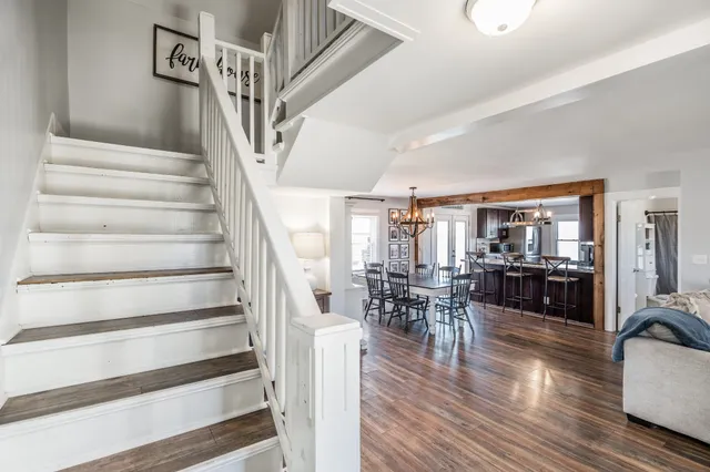 a view of a livingroom with furniture and wooden floor