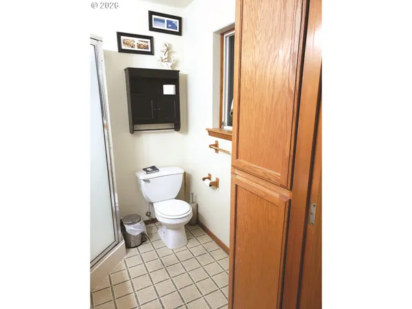 a white toilet sitting next to a small sink