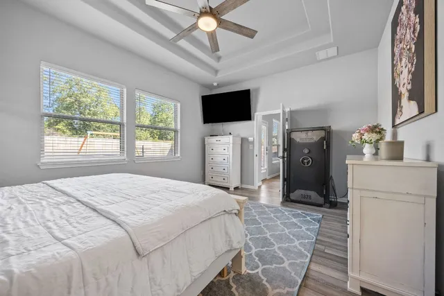 a bedroom with a bed and a television