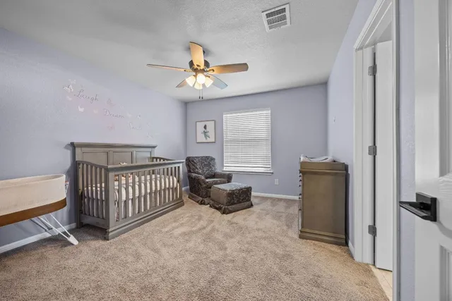 a bedroom with furniture and a window