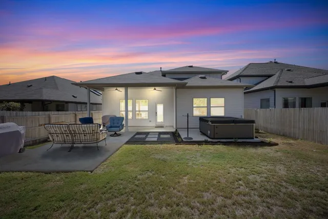 a view of a house with a back yard