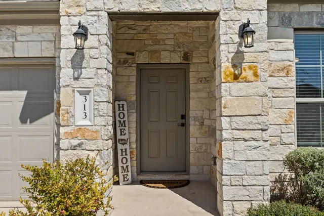 a brick building with a door and a window