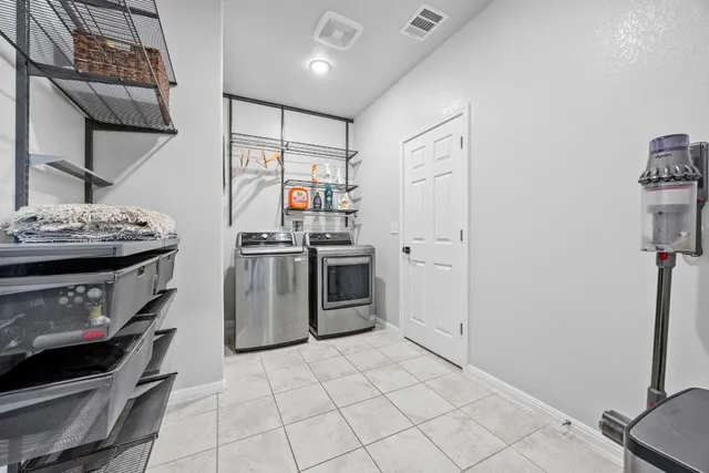 a kitchen with stainless steel appliances granite countertop a stove and a refrigerator