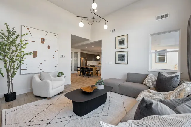 a bathroom with a sink a toilet a mirror and shower